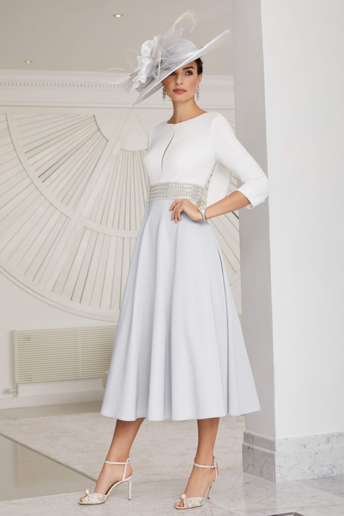Mid length dress with full skirt and pearl waist design. 70477 ...
