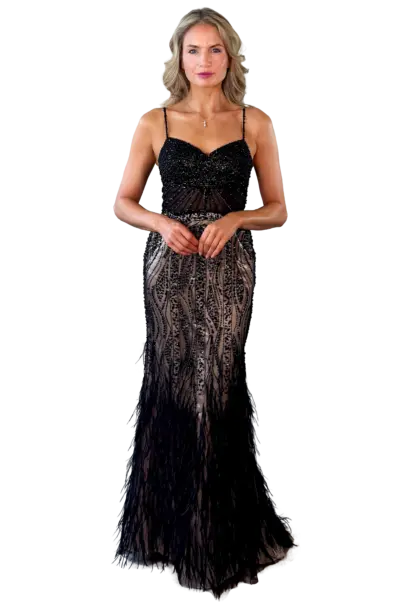 A woman models a black beaded and feathered gown.