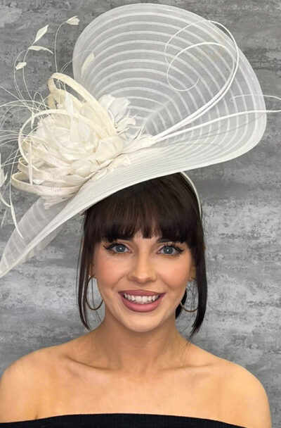 Elegant white hat with upturned brim and feather details for special occasions.