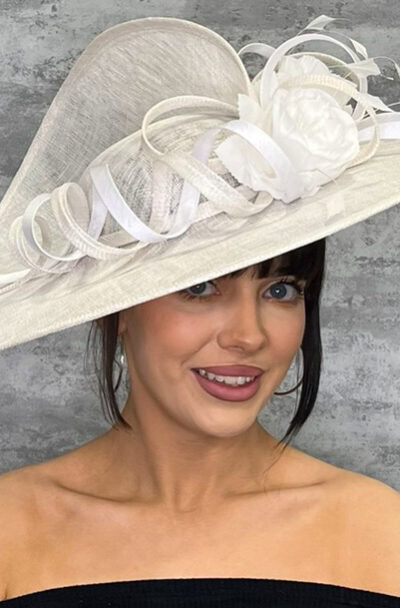 White split saucer hat with decorative ribbons and flowers for special occasions.