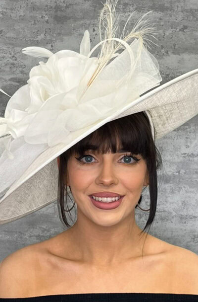 Elegant white hat with floral and feather details for special occasions.