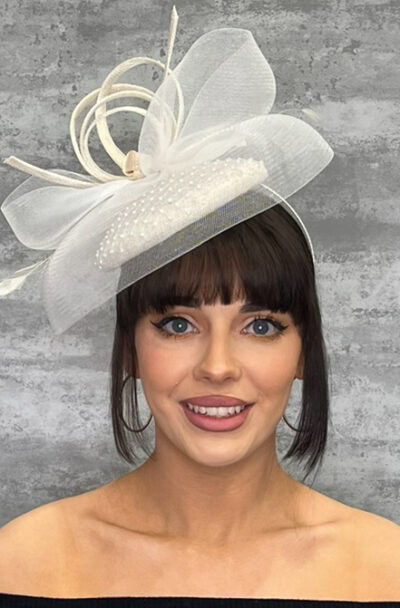 White hat with veiling and loops for special occasions.