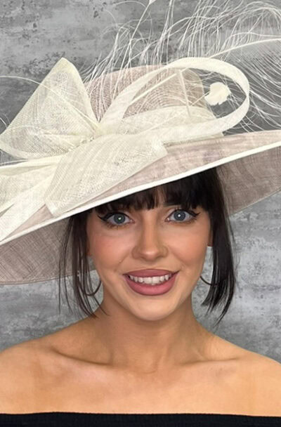 Stylish large hat with bow detail for special occasions.