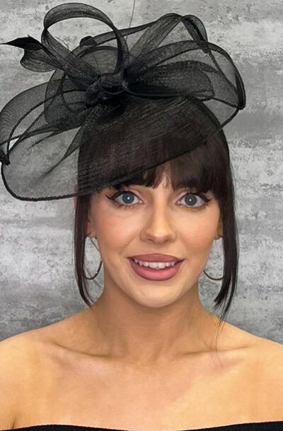Elegant black crinoline hat with loops, perfect for special occasions.