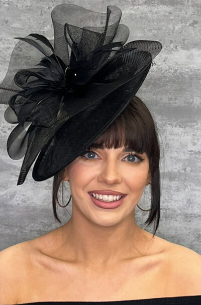 Elegant black hat with large disc and crinoline wave for special occasions.