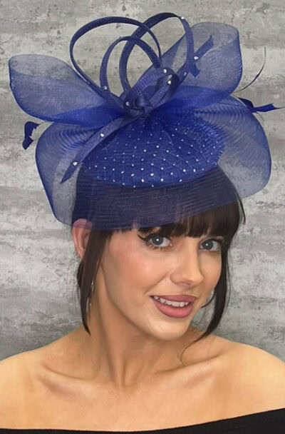 Elegant blue hatinator with diamante embellishments and decorative loops.