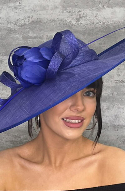 Elegant blue hat with sinimay loops and flower detail for special occasions.