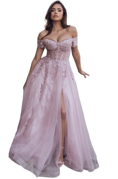 A woman models an elegant pink off-the-shoulder evening gown.