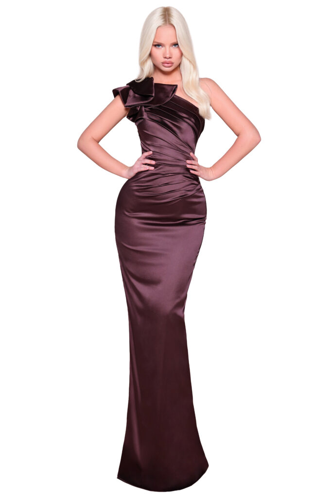 Blonde model in a one-shoulder brown satin evening gown.
