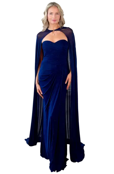 Woman in an elegant sparkling blue gown with a cape.