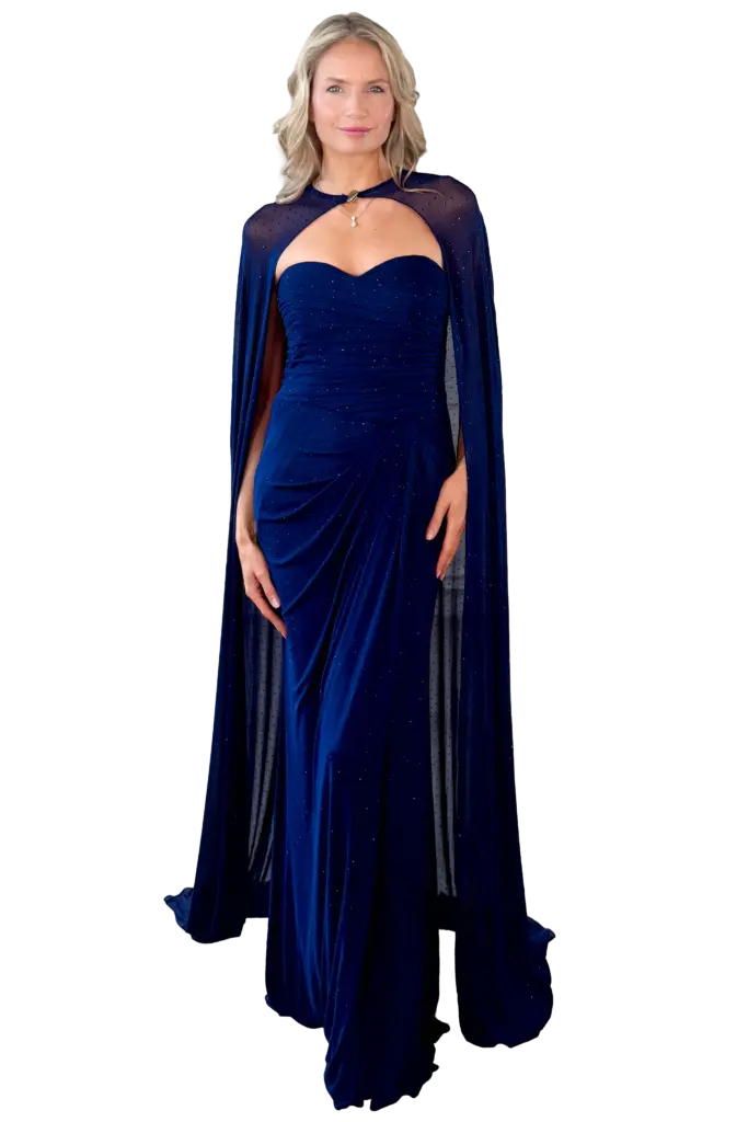 Woman in an elegant sparkling blue gown with a cape.