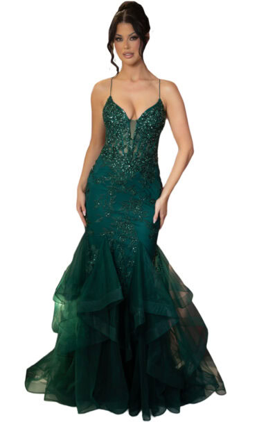 Woman in an emerald green sequined mermaid evening gown.