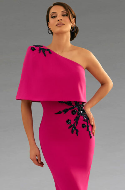 Woman models an elegant one-shoulder pink gown with embellishments.
