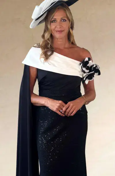 A woman in an elegant black and white dress.