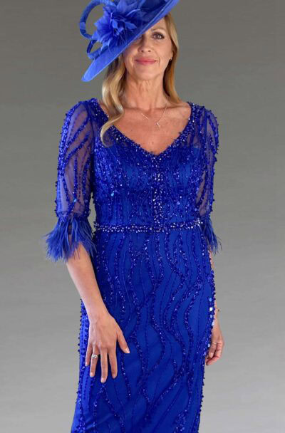 A woman in a royal blue sequined dress and hat.