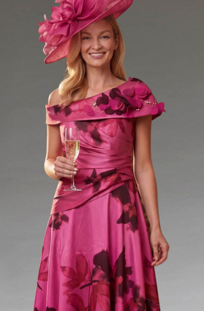 Woman in a pink floral dress and matching hat.