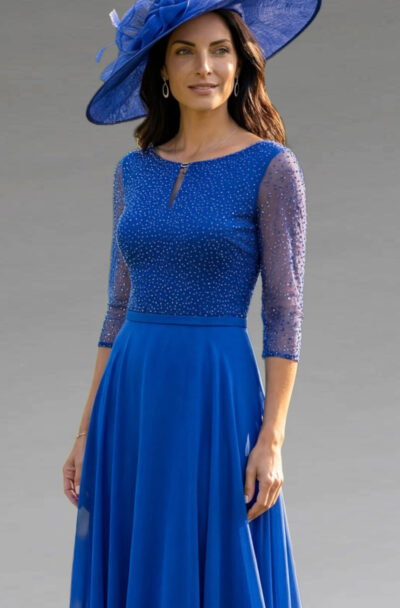 A woman wearing an elegant royal blue dress and hat.