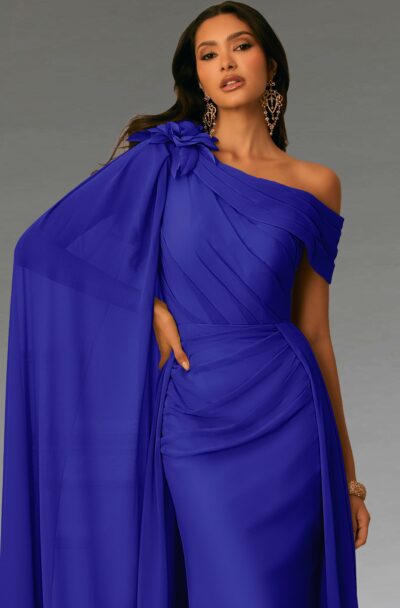 A woman models an elegant one-shoulder royal blue gown.