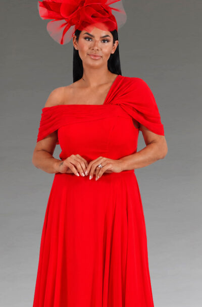 Woman in a red off-the-shoulder dress and matching fascinator.