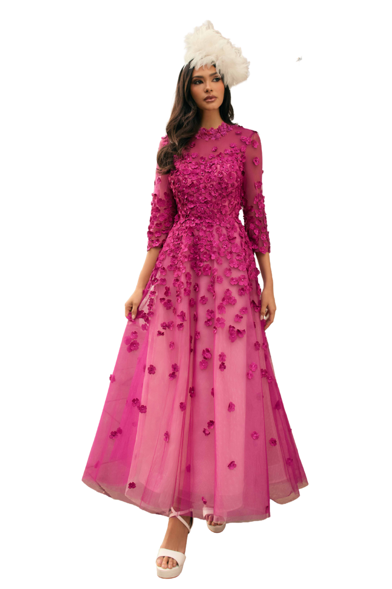 Woman in magenta floral appliqué gown with feather fascinator.