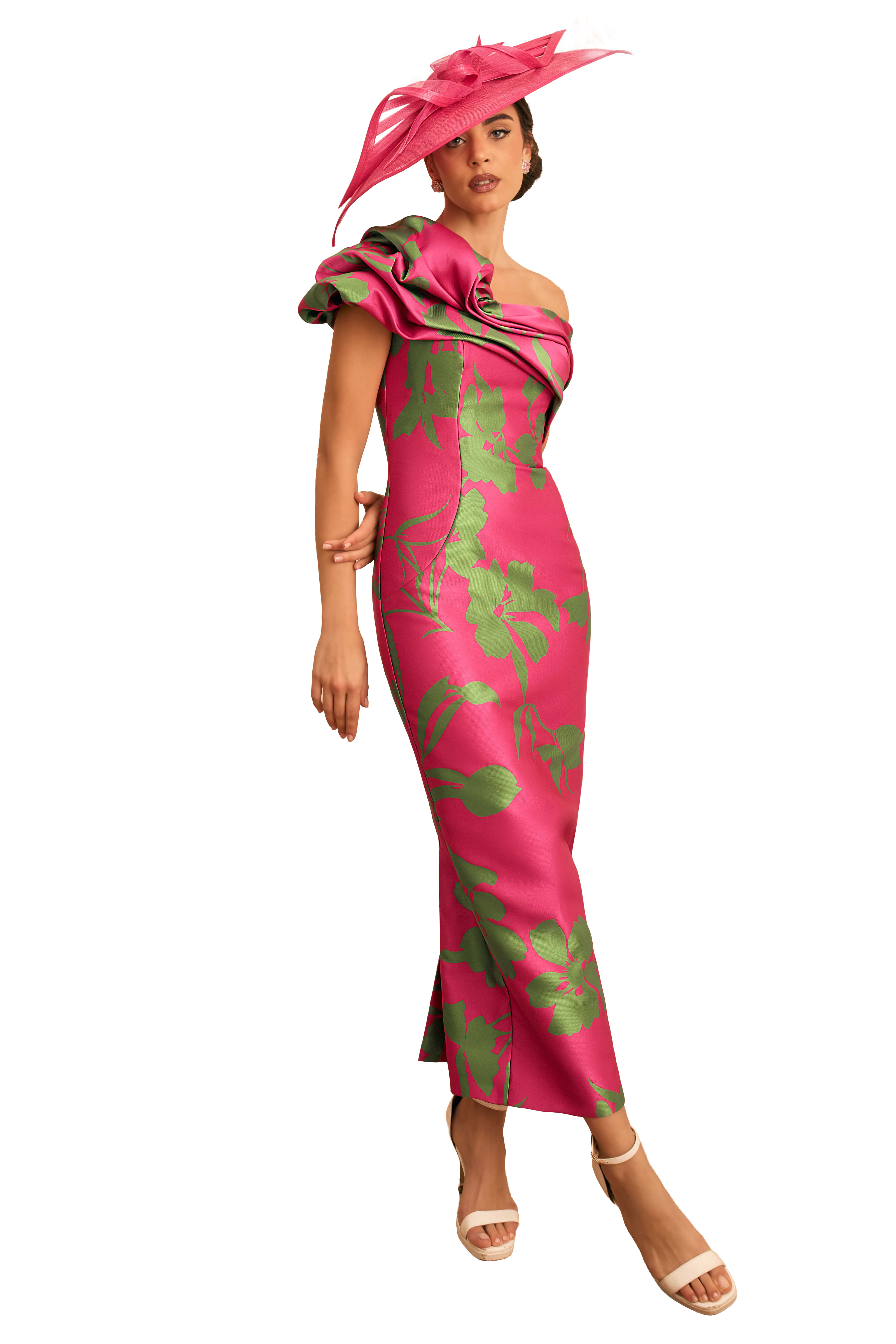A woman in a pink floral dress and large hat.