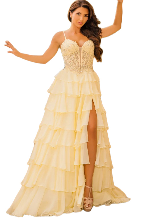 A woman posing in a tiered yellow evening gown.