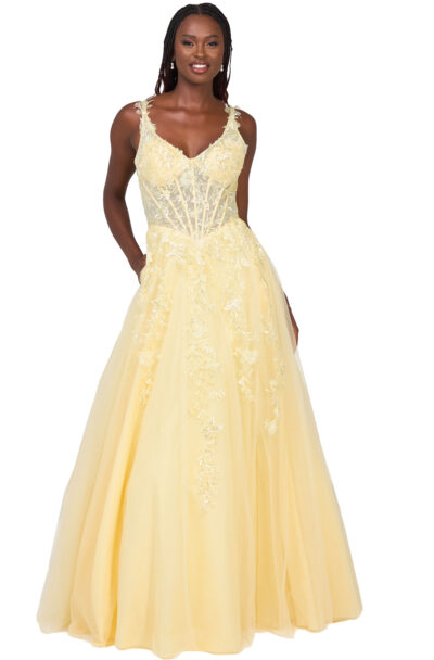 A smiling woman wearing a yellow lace ball gown.