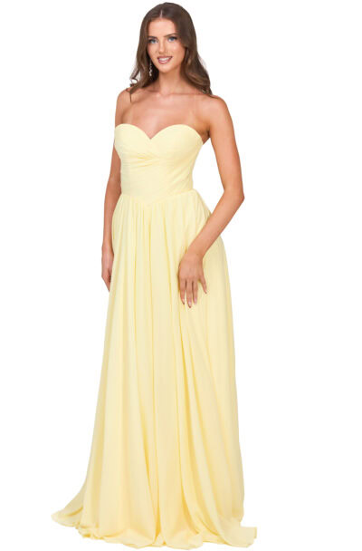 A woman wearing a long pale yellow strapless gown.