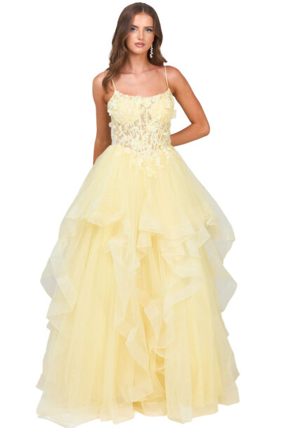 A woman wearing a yellow floral ball gown.