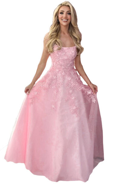 A smiling blonde woman wearing a pink floral ball gown.