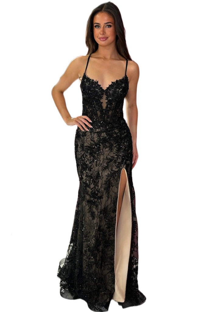 Woman in a black lace evening gown with thigh split.