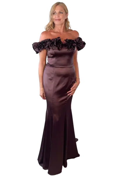 Woman in an elegant off-the-shoulder brown formal gown.
